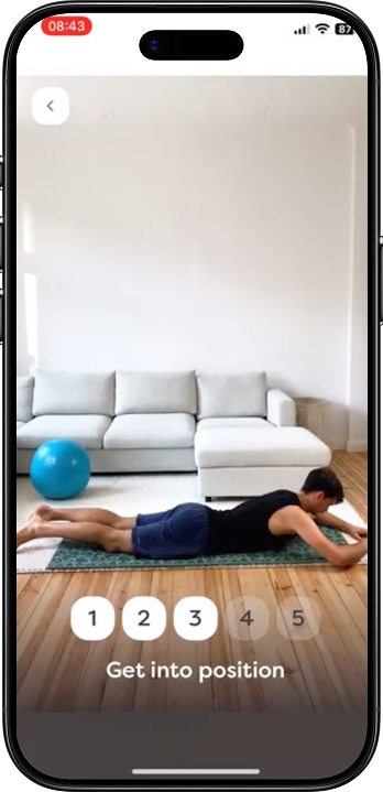 Exercise step view with the video demonstration, steps one to five and a “Get into position” cue.
