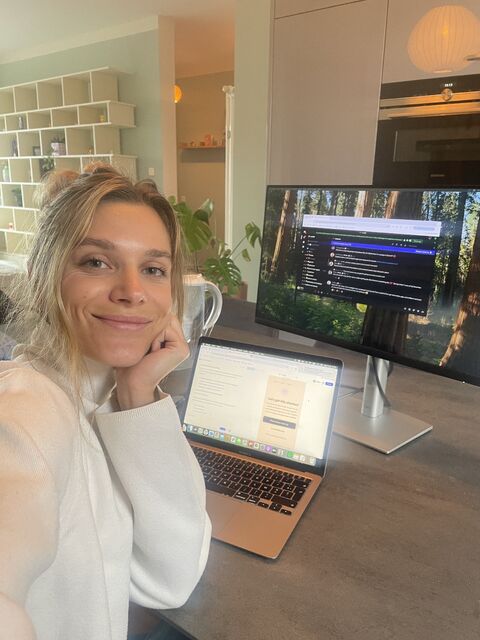 Clé working on the SheBuilds hackathon project at her desk